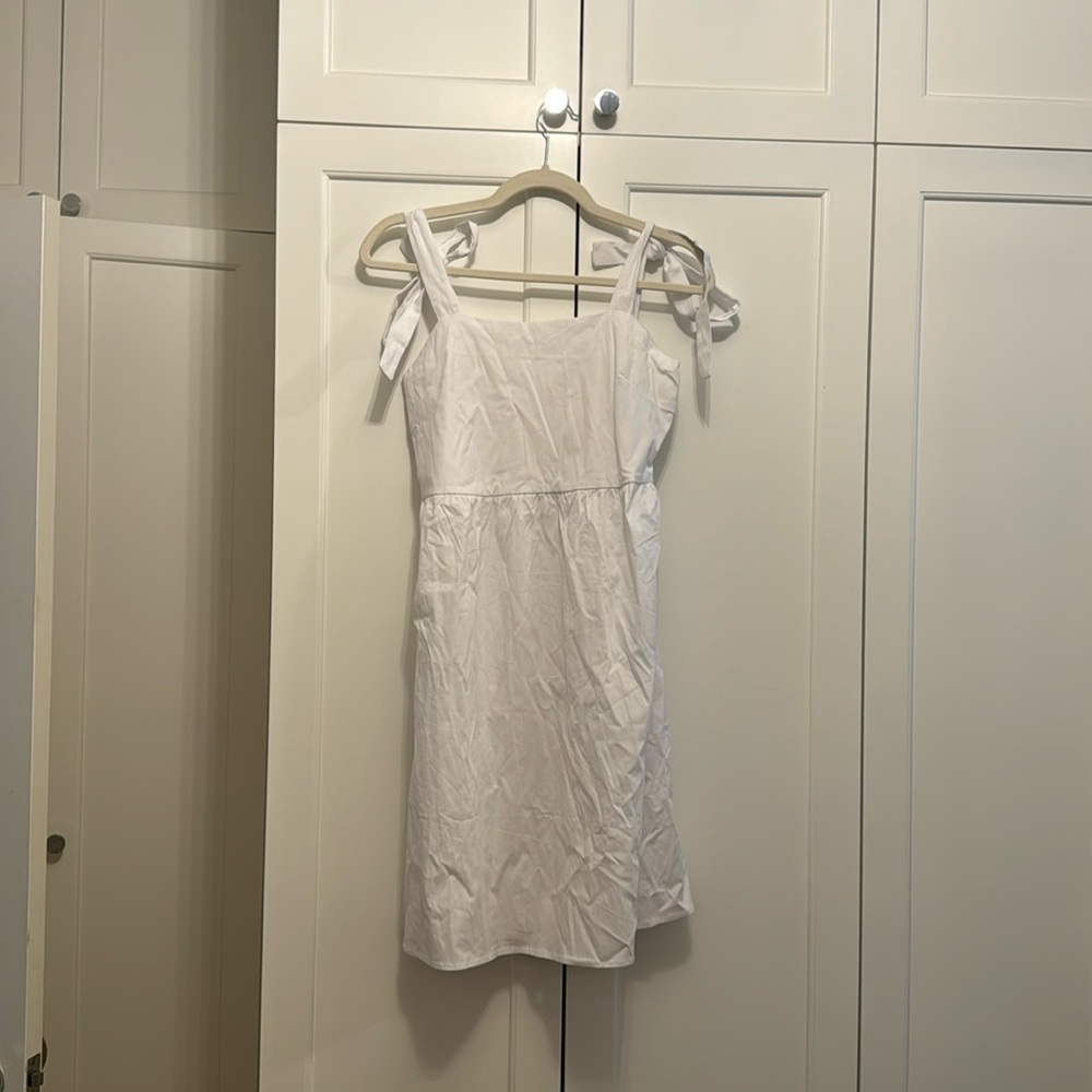 White dress with tie straps, zip on side
